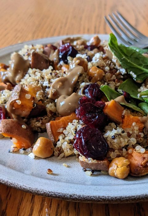 Quinoa sweet potato power bowl with avocado balsamic dressing