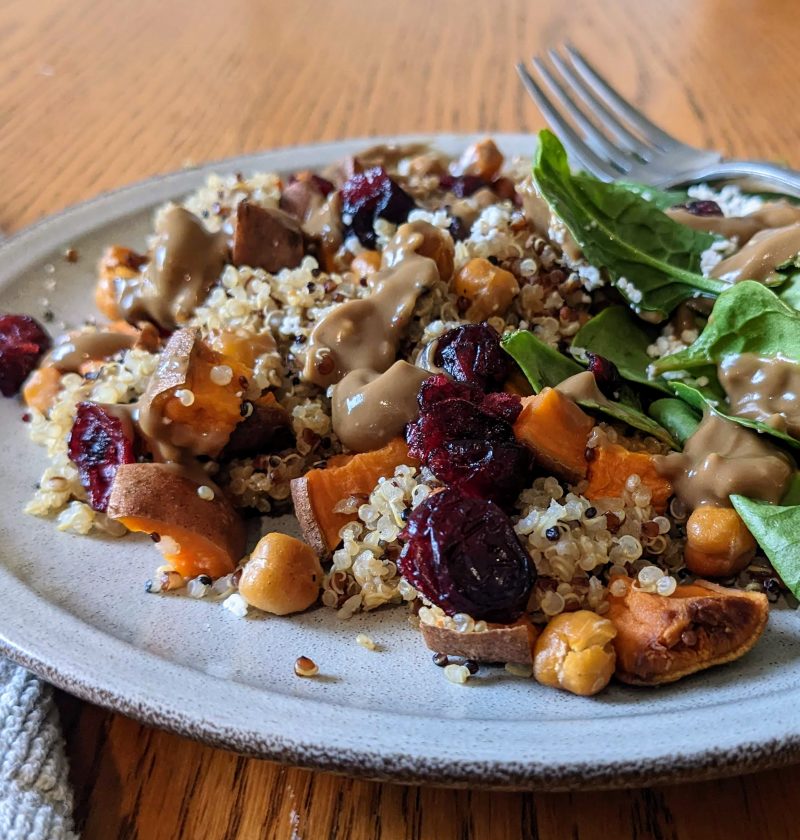 Quinoa sweet potato power bowl with avocado balsamic dressing